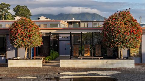 An exterior shot of the front of Heath Ceramics showroom and factory in Sausalito, California, which was designed in 1959 by Marquis & Stoller in collaboration with founders Edith and Brian Heath.