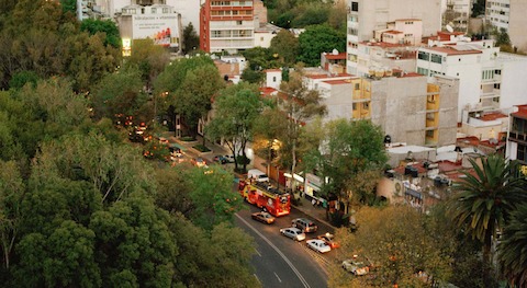 The view from Michel Rojkind's office, overlooking a typical Mexico City traffic scene and the edge of Parque de España.