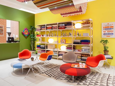 Girard's Color Wheel Ottomans and Eames Upholstered Molded Fiberglass Arm Chairs form the basis of a Girard-inspired living room. Girard's Color Wheel Ottomans and Eames Upholstered Molded Fiberglass Arm Chairs form the basis of a Girard-inspired living room.