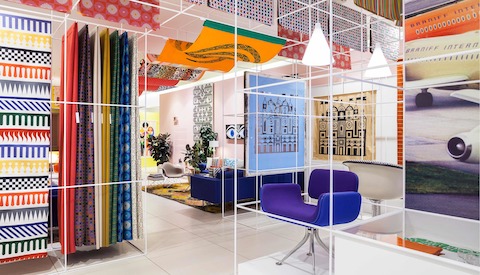 Colorful textiles designed by Alexander Girard hang in a temporary installation in New York City.