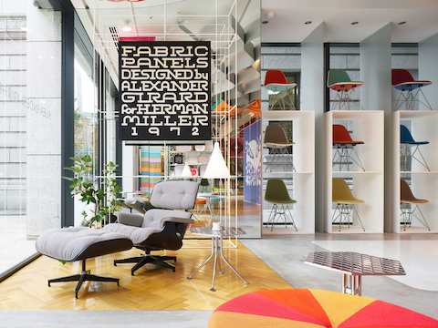 A custom Eames Lounge Chair upholstered with Maharam Minicheck; plastic and fiberglass Eames shell chairs in colorful Checkers.