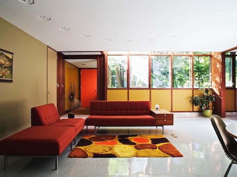 The main entrance to the Kirkpatrick house leads into a common living/dining area. The arc of recessed, dimmable lighting in the ceiling once traced the outline of a custom sofa Nelson designed for the space. It was sold by a previous owner of the home.