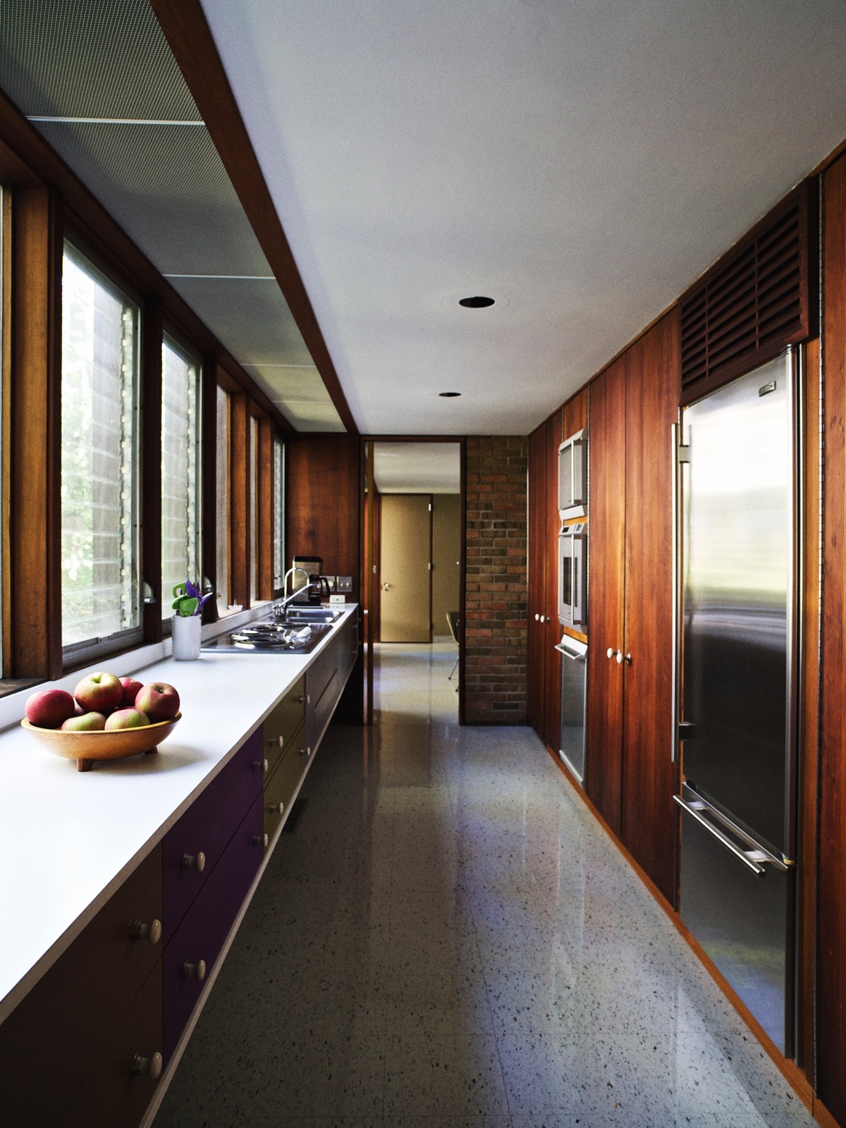 The galley-style kitchen cabinets are all original and were repainted to match Nelson's specifications using the Container Corporation's Color Harmony Manual.
