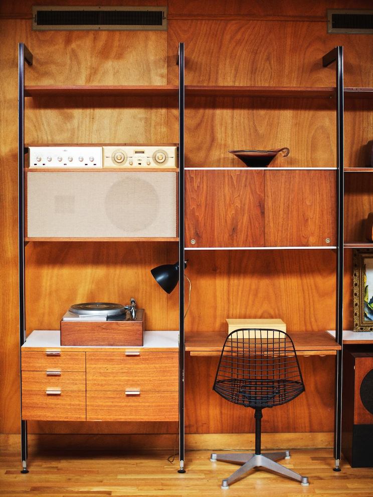 An original Nelson CSS system is outfitted with a Rek-O-Kut record player designed by the Nelson office and paired with an Eames Wire Chair-Contract Base.