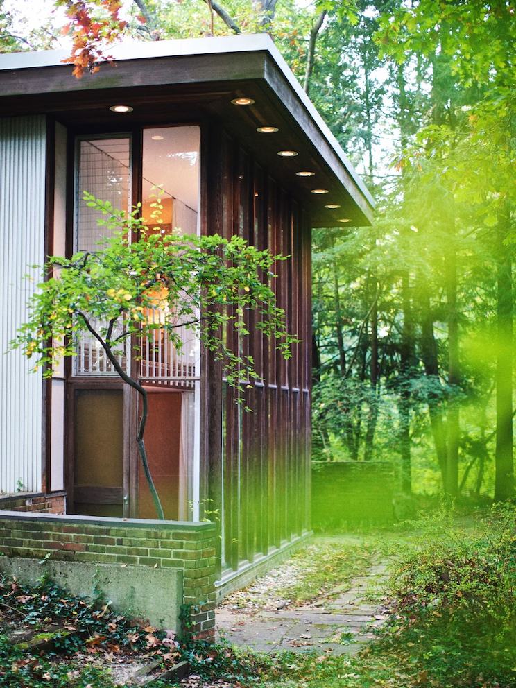 An exterior view into the living room and master bedroom above.