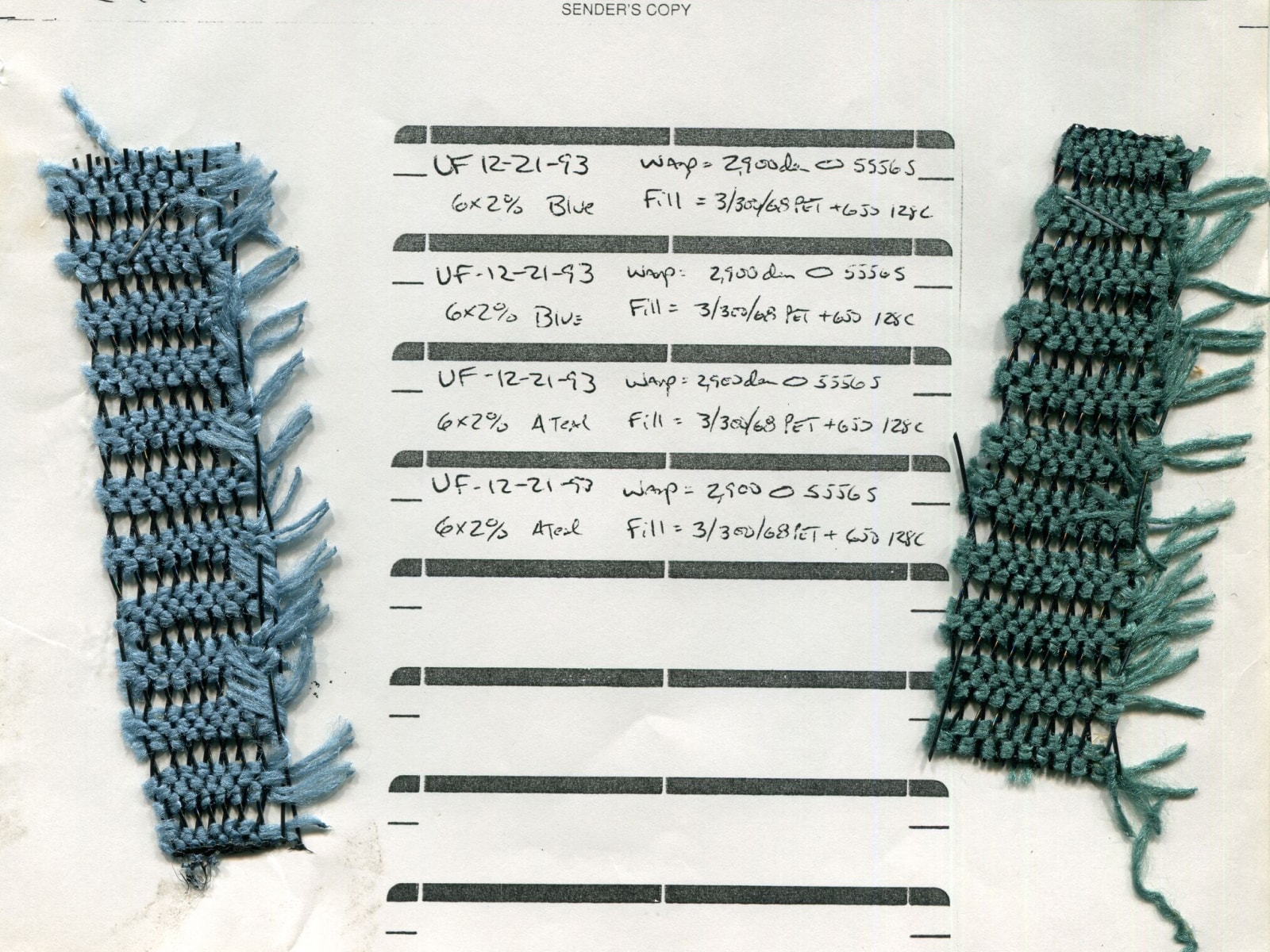 Overhead view of Pellicle material samples in blue and green with handwritten labels to describe them.