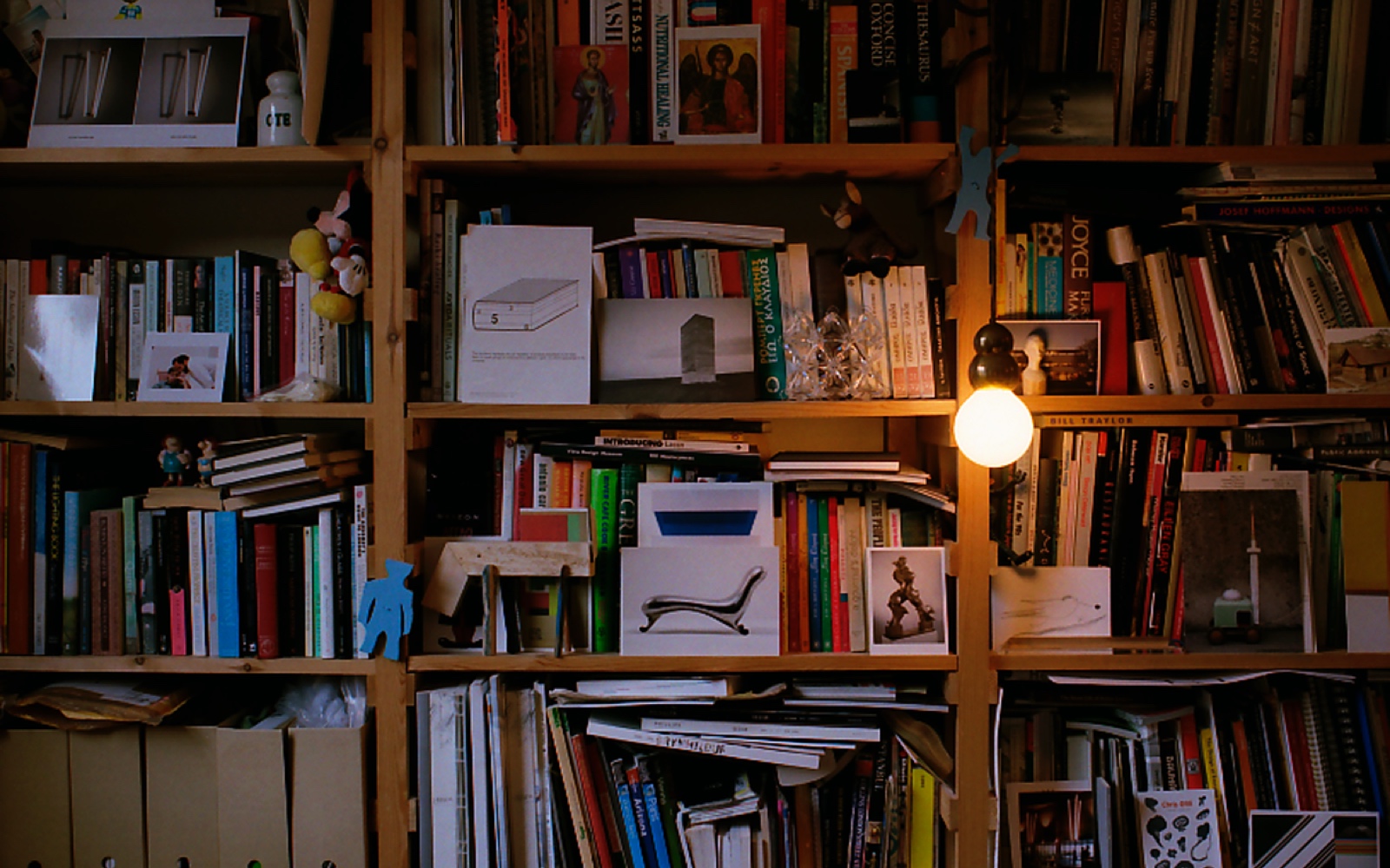 Floor-to-ceiling Enzo Mari shelves storing books, early design experiments, and material samples in the home studio of designer Michael Anastassiades.