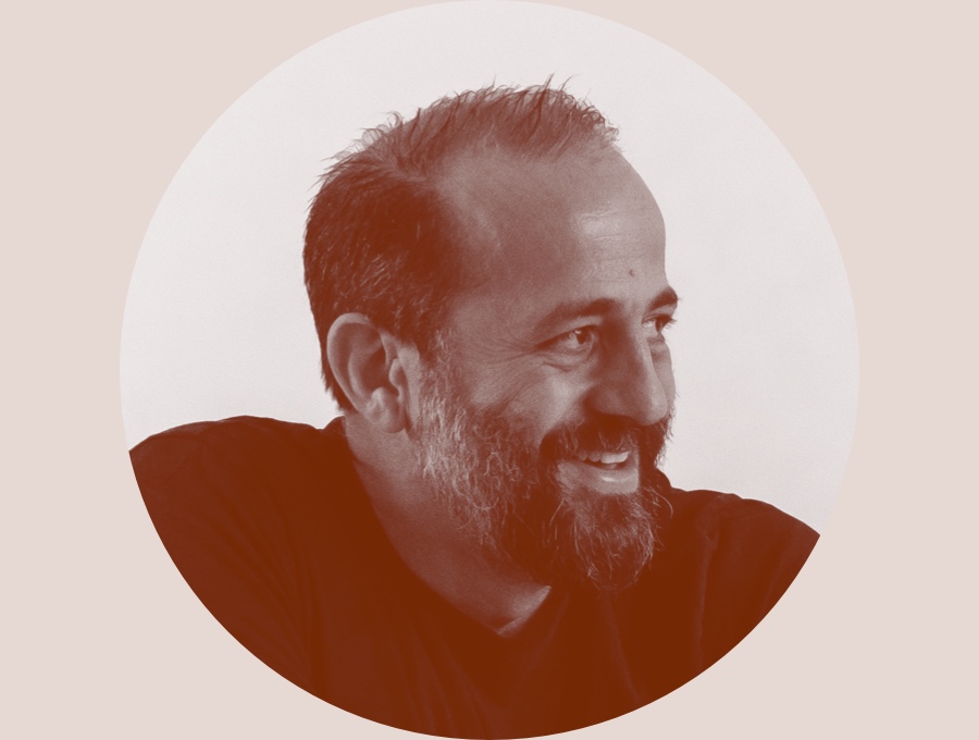 A black and white profile portrait of designer Michael Anastassiades.