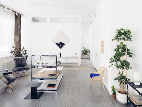 Various Projects selected long Icelandic sheep hair for the Scissor Chairs (left) and a Kvadrat Divina blue wool cushion for the Landmark Chair in natural cane (right).