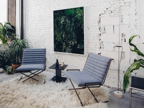 In the back reading room, two Sled Chairs upholstered in Japanese denim along with an I Beam Table. In the back reading room, two Sled Chairs upholstered in Japanese denim along with an I Beam Table.