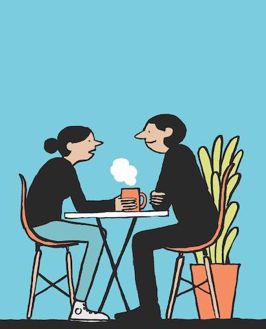 A cartoon of two women interacting while seated at a small round table. Translated copies of Design the Life You Love