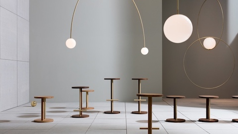 A large room showcasing Spot Stools of different  heights. Select to go to a WHY Magazine interview of designer Michael Anastassiades.