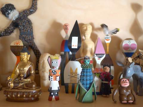 A collection of folk art figurines. A collection of folk art figurines.