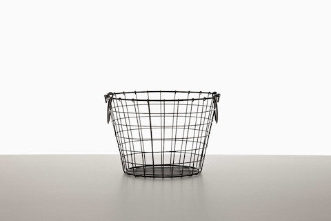An empty black wire basket. An empty black wire basket.