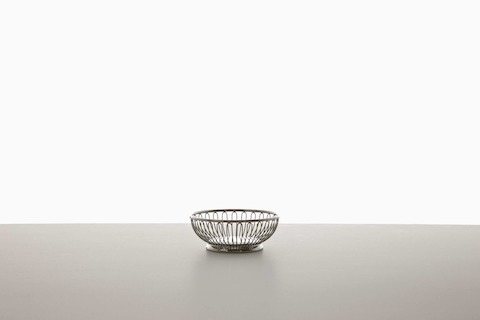 A small, round, and empty wire basket. A small, round, and empty wire basket.